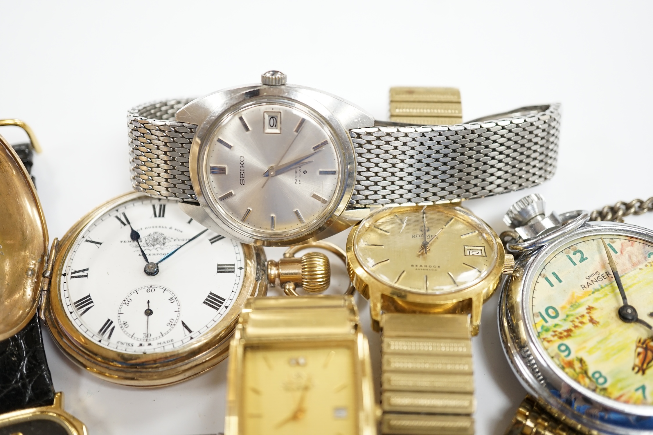 A small group of assorted wrist and pocket watches including a gold plated hunter and a Roamer Searock.